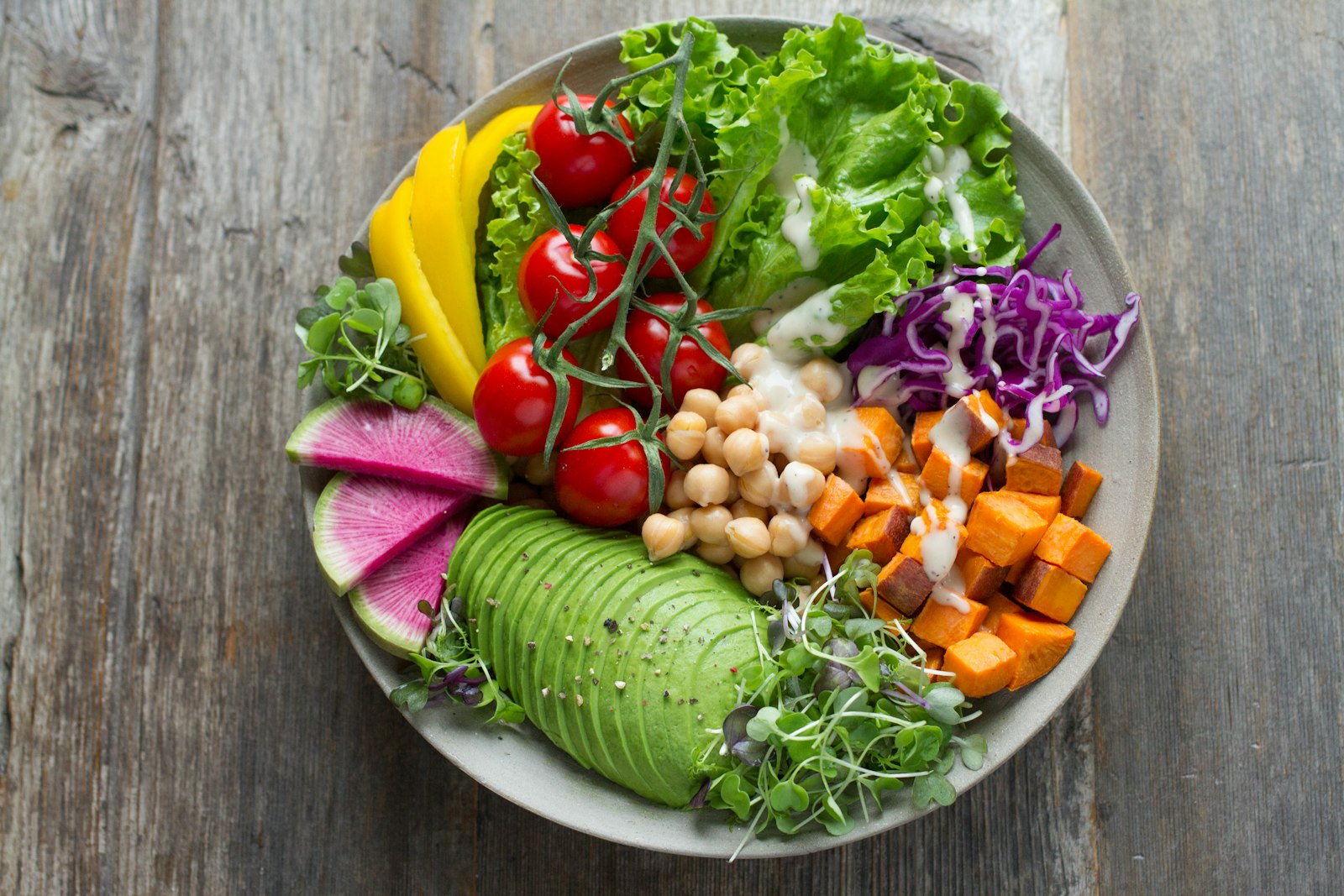 Assorted healthy foods like fruits, vegetables, and dairy for dental nutrition